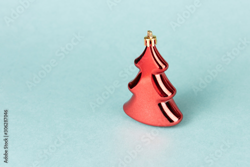 Decorative Christmas tree on decorative colored background.