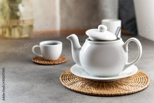 White porcelain tea cup and teapot  Afternoon tea table setting