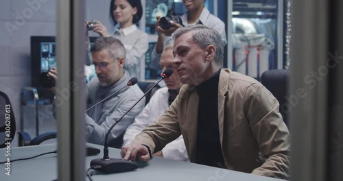 Astronauts talking with journalists before departure