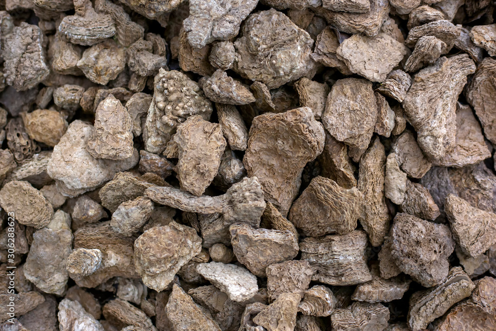 Rough stones rubble background. Grunge brown rock textured. Rough stones rubble background. Grunge brown rock textured.