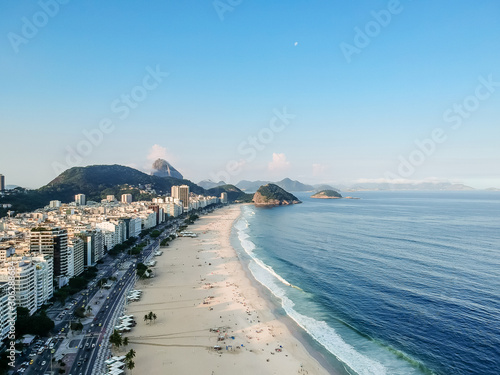 aerial drone view of Copacabana beachs during late afternoon,, some shadows can be seen on the sand. Rio de Janeiro, Brazil