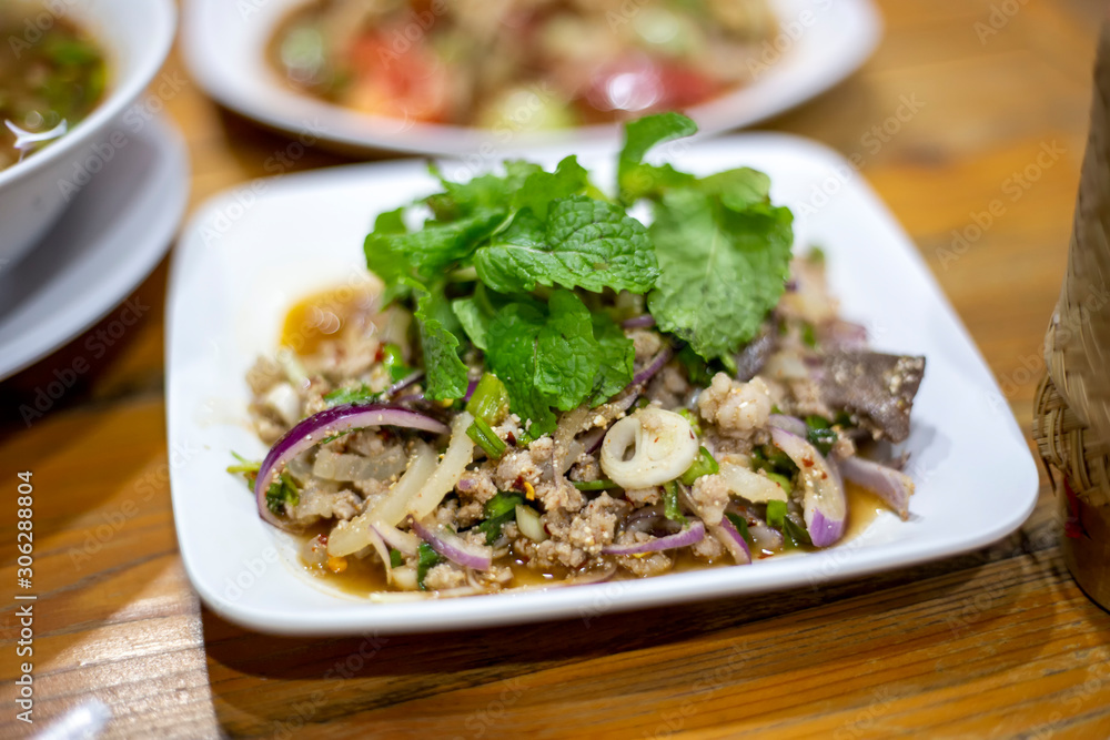 Minced pork spicy salad northeastern Region thailand style (Larb Moo isan). Thai yummy local food.
