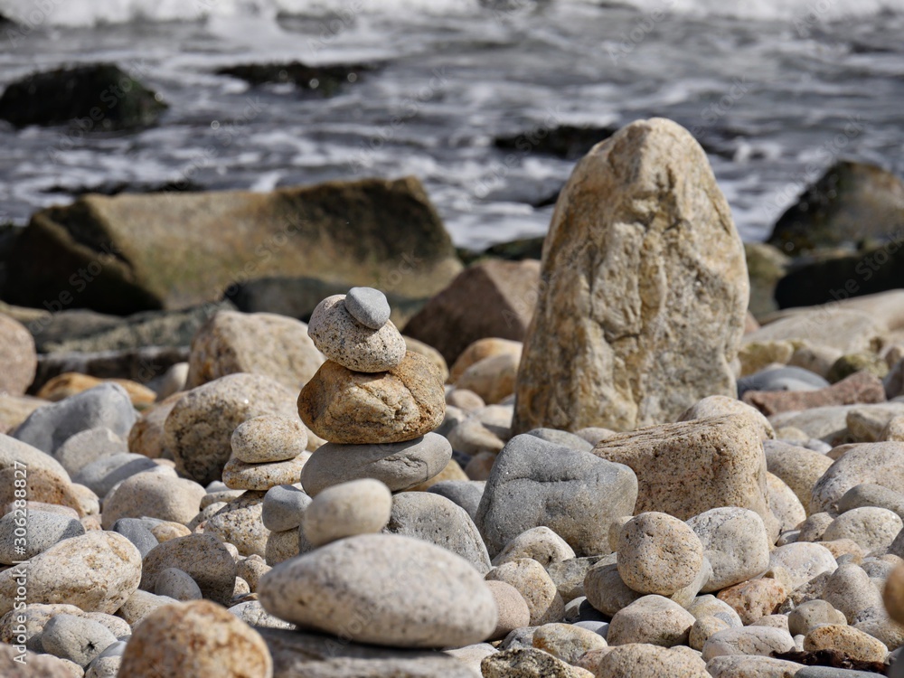 Artistic pile of stones and rocks at the beach Artistic pile of stones and rocks at the beach