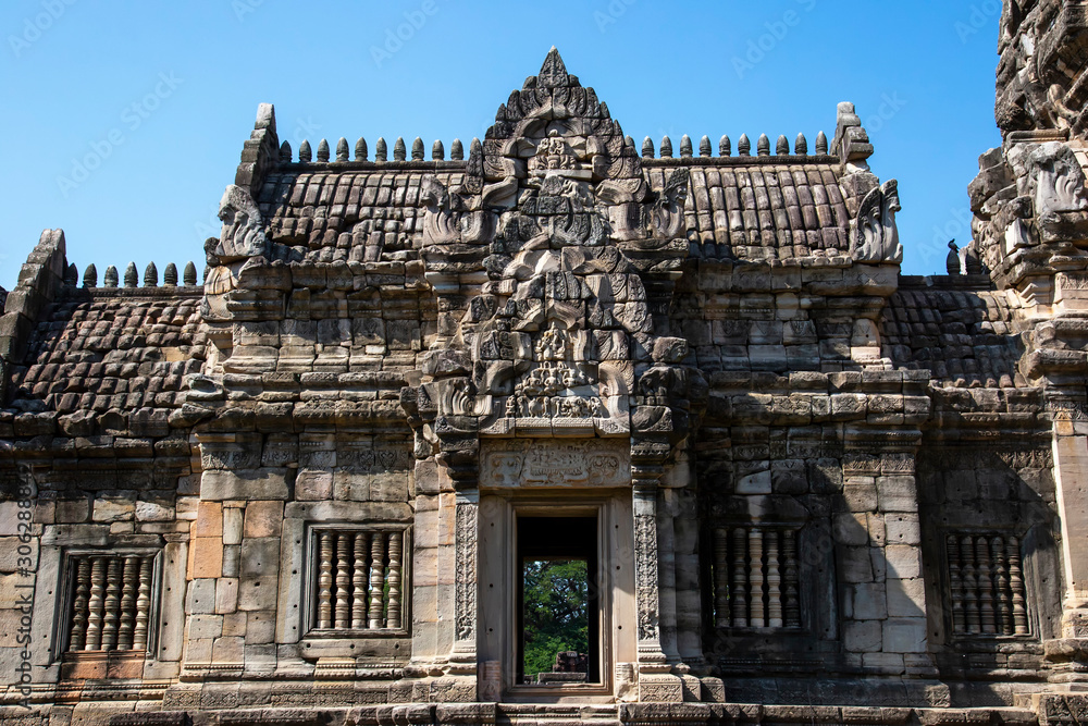 Antiques sandstone carving Khmer architecture on Phimai castle historical park.