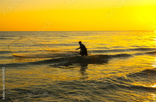Wallpaper Mural The fisherman cast a net the sea in the morning, at sunrise, Songkhla Thailand Torontodigital.ca