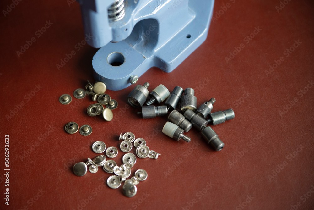 Close up, press machine, tool and leather fittings. Close up, press machine, tool and leather fittings.