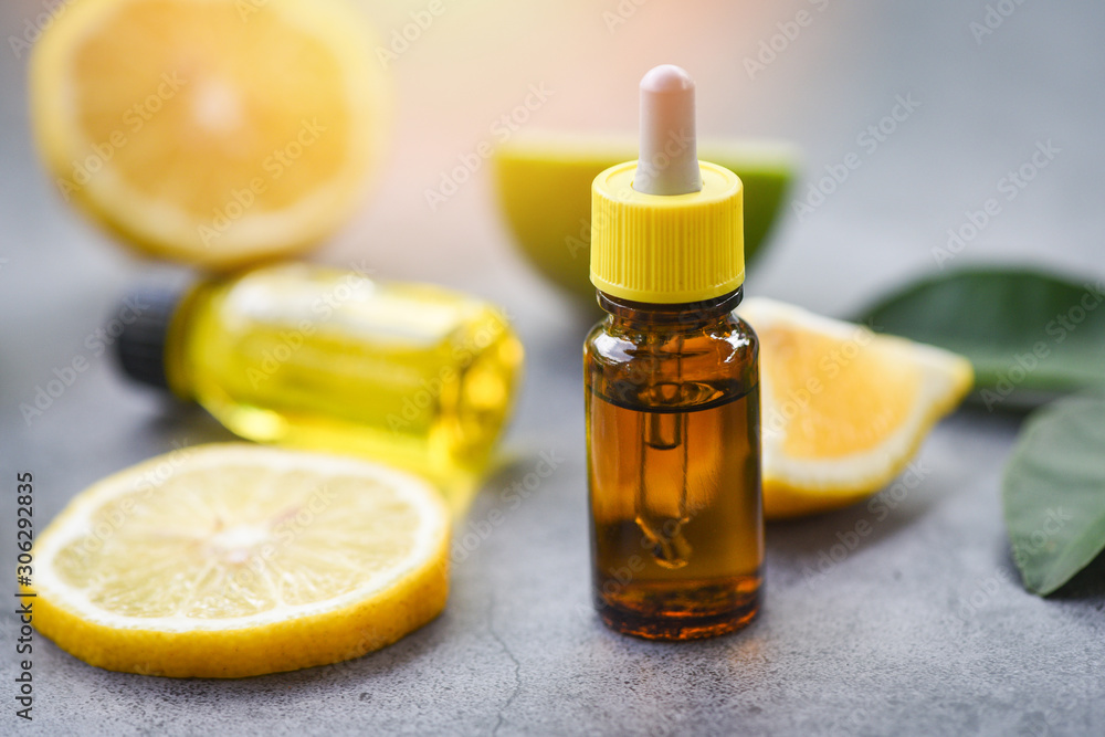 Aromatherapy herbal oil bottles aroma with lime lemon leaves herbal with candle formulations top view - Essential oils Aromatherapy herbal oil bottles aroma with lime lemon leaves herbal with candle formulations top view - Essential oils