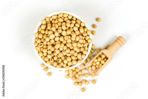 Soybean isolated on white background / dry soy beans on bowl