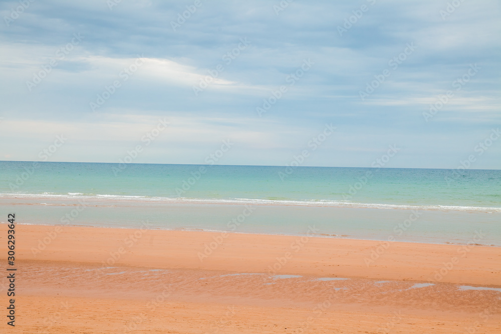 Coastal beach landscape scene of sand and water