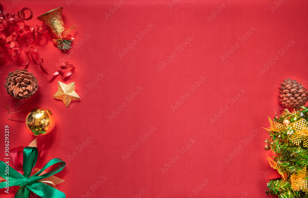 Christmas composition festive. Christmas decorations, red and gold ornaments on red background. Celebration for Christmas, New Year, winter holiday concept. Flat lay, copy space.