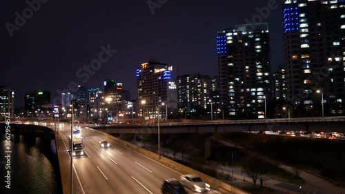 Wallpaper Mural Street traffic on highway with city skyscrapers at night. Torontodigital.ca