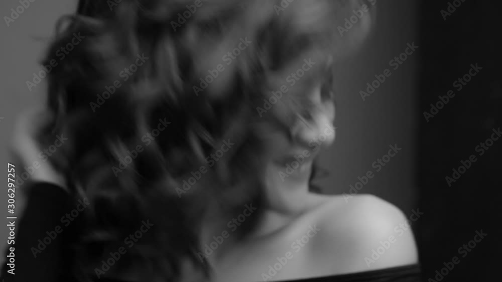 Brunette posing on camera. Black and white video. Emotions girls with a slight flirtation. Chewing gum. Brunette posing on camera. Black and white video. Emotions girls with a slight flirtation. Chewing gum.