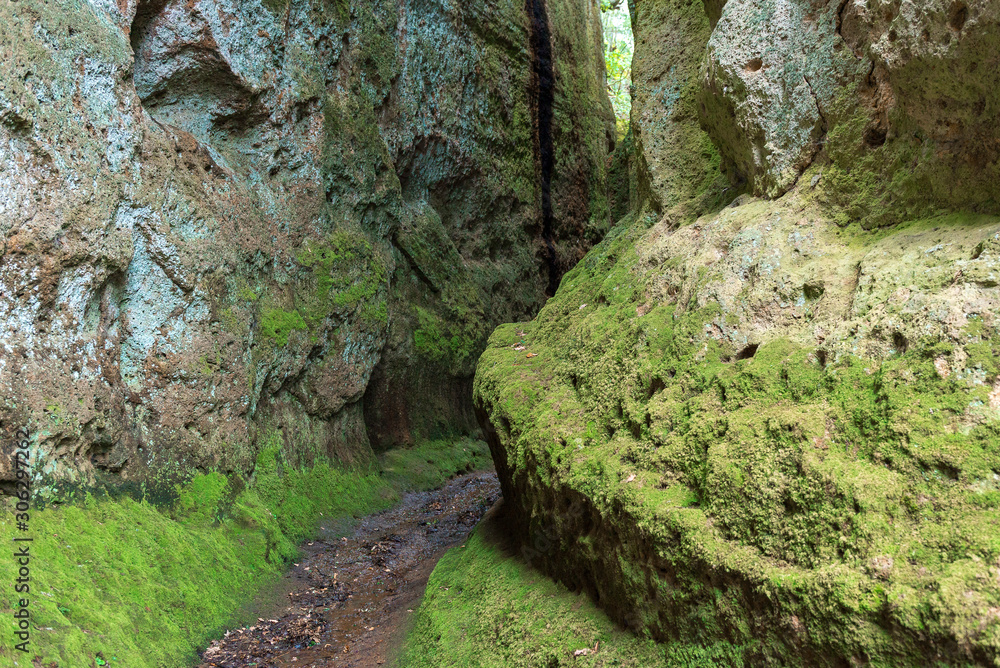 Etruscan Via Cava, one of the path dug into the tuff rock that connected ancient necropolis and several settlements in the area of Sovana and Sorano Etruscan Via Cava, one of the path dug into the tuff rock that connected ancient necropolis and several settlements in the area of Sovana and Sorano