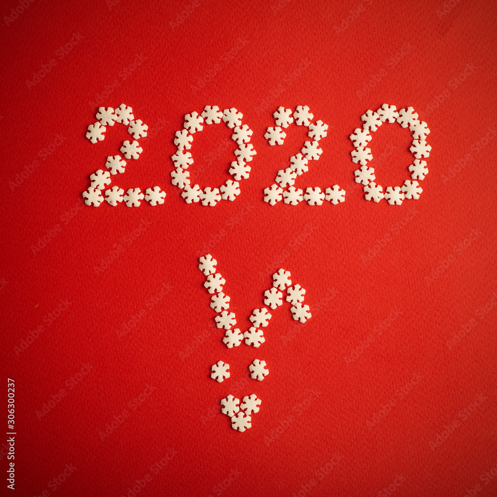 New Year 2020. Creative number 2020 written in white snowflakes on a red background for design. New Year 2020 concept New Year 2020. Creative number 2020 written in white snowflakes on a red background for design. New Year 2020 concept