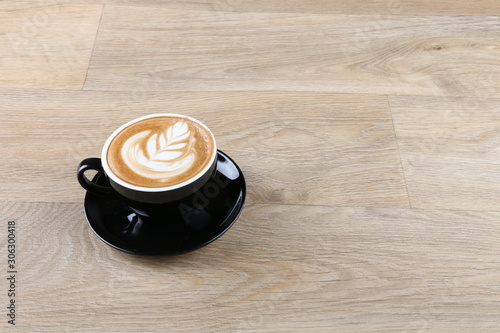 Coffee Cup - Coffee in a black cup isolated on a wooden background - Cappuccino Latte Espresso Macchiato 