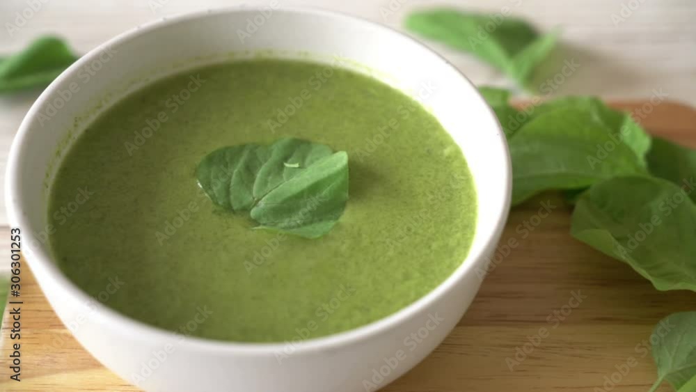 spinach soup bowl on wood background spinach soup bowl on wood background