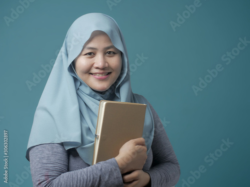 Happy Muslim Lady with Book © airdone