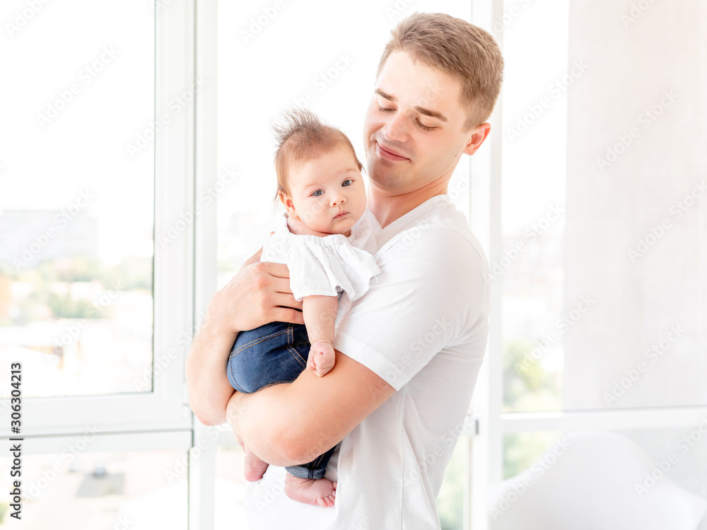 Father embracing infant Father embracing infant