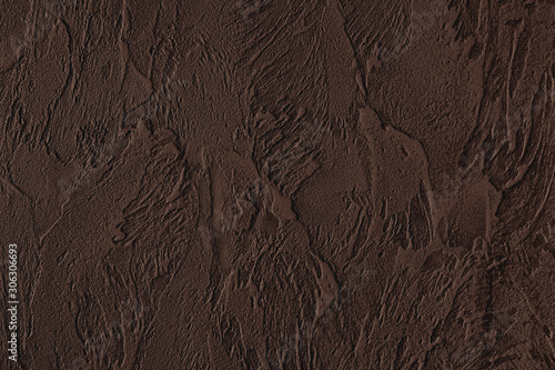 Dark brown colored low contrast Concrete textured background with roughness and irregularities to your design or product.
