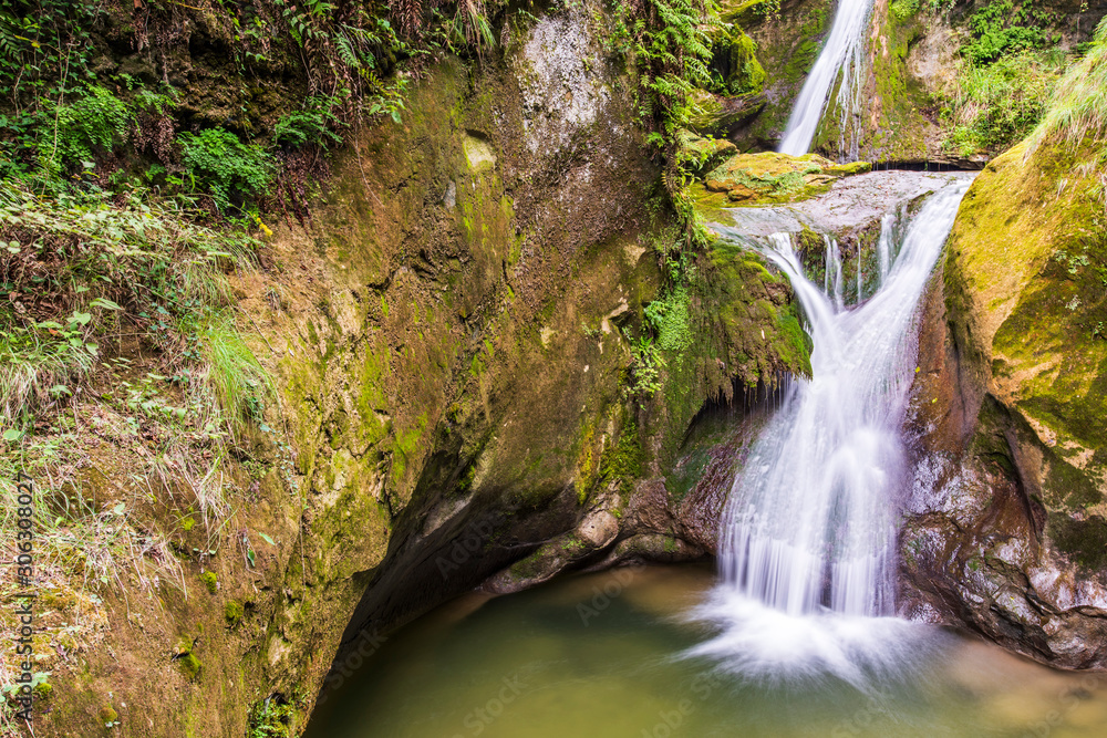 Caglieron caves and waterfalls. Magic of emerald. Vittorio Veneto, Italy