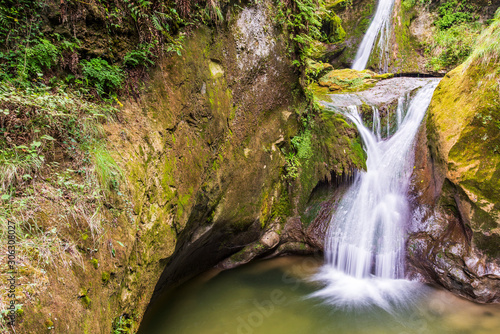 Caglieron caves and waterfalls. Magic of emerald. Vittorio Veneto, Italy