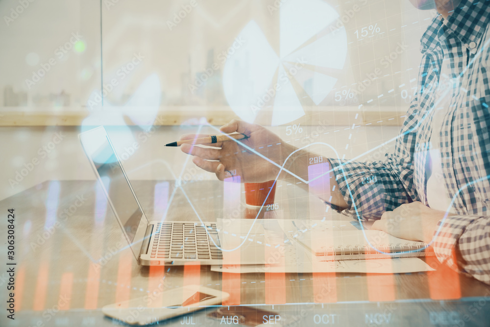 Multi exposure of stock market chart with man working on computer on background. Concept of financial analysis. Multi exposure of stock market chart with man working on computer on background. Concept of financial analysis.