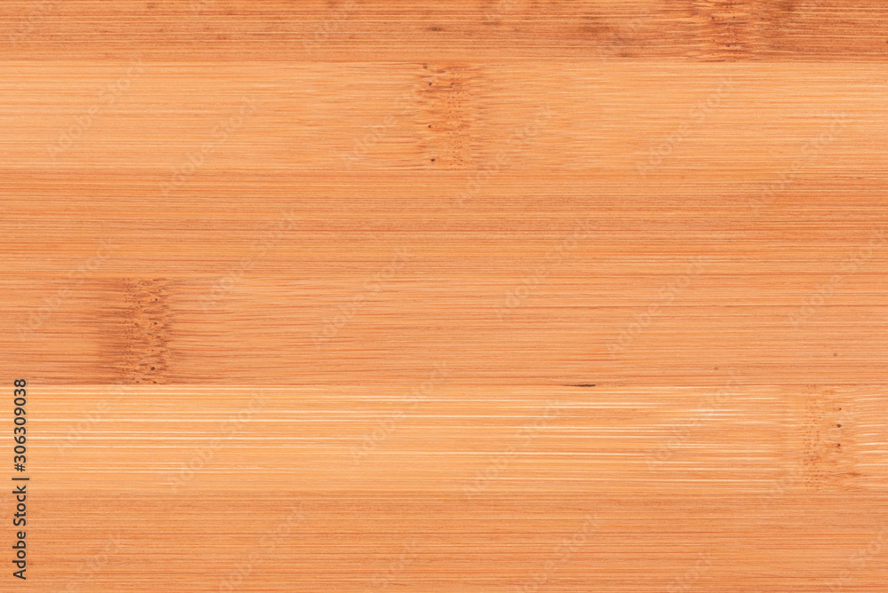 Naklejka premium Wooden cutting board close up texture background.