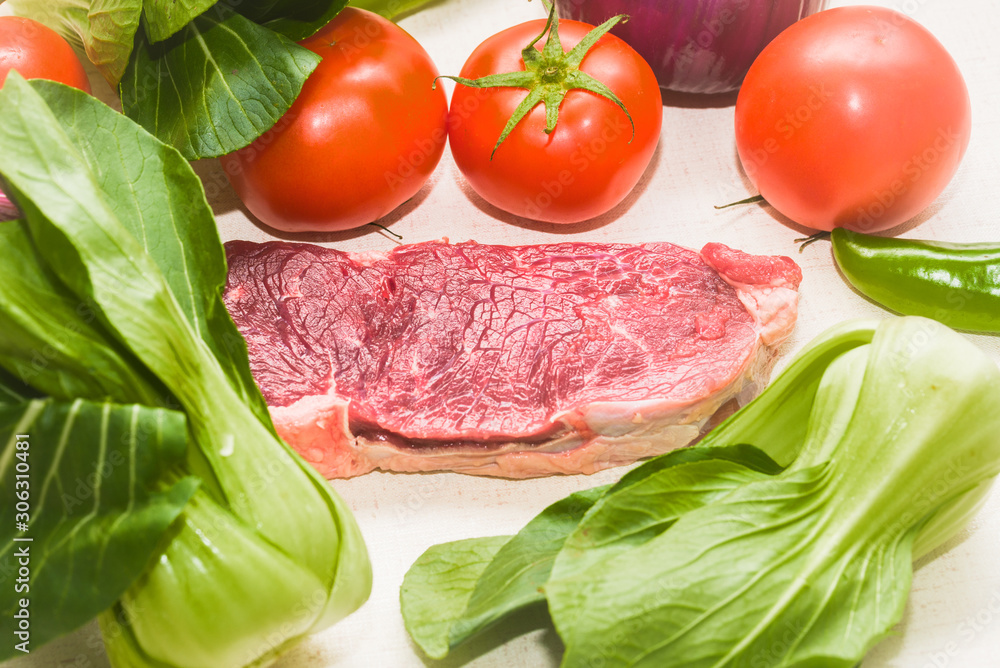Raw beef with fresh vegetable shed pats Raw beef with fresh vegetable shed pats