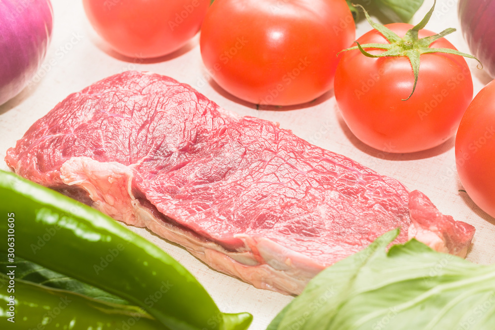 Raw beef with fresh vegetable shed pats Raw beef with fresh vegetable shed pats