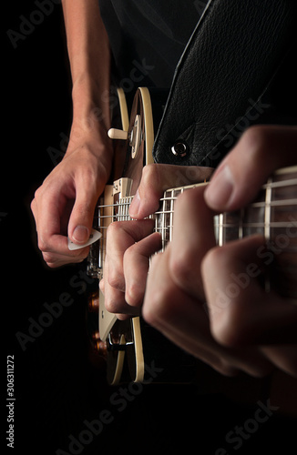 Three Hands Playing Guitar photo