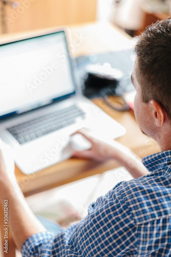 Man working with laptop at home