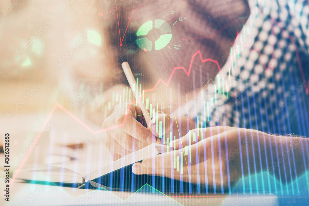 Multi exposure of two men planing investment with stock market forex chart. Multi exposure of two men planing investment with stock market forex chart.
