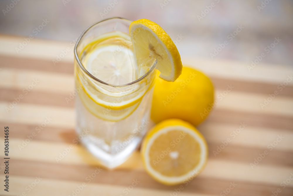 1 cup lemon water and cut lemon on the table 1 cup lemon water and cut lemon on the table