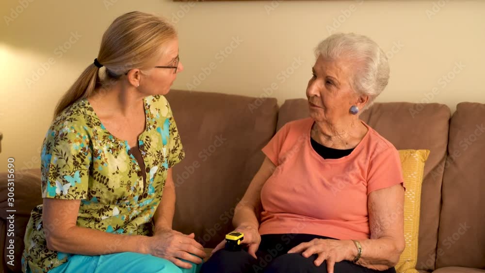 Measurement of the pulse on elderly woman. Placed on the finger heart rate monitor. Measurement of the pulse on elderly woman. Placed on the finger heart rate monitor.