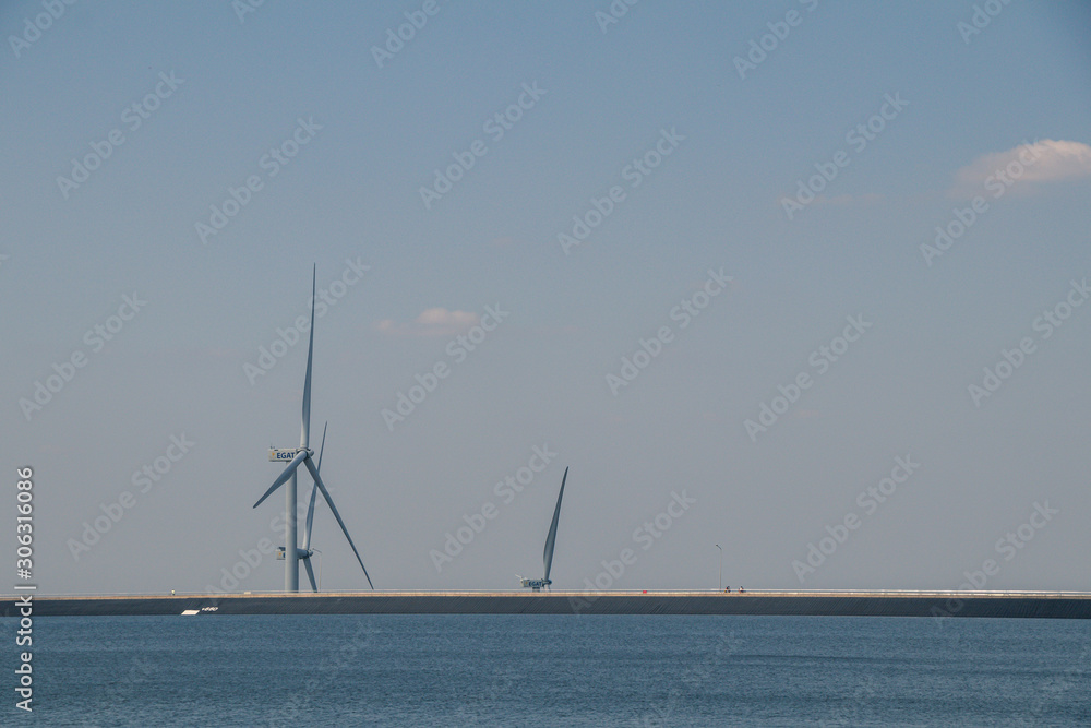 Wind turbines or wind wheels and blue sky background.