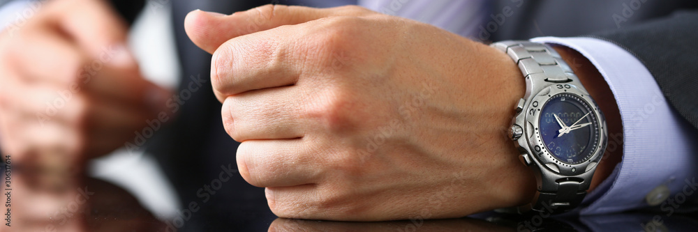 Fototapeta premium Man in suit and tie check out time at