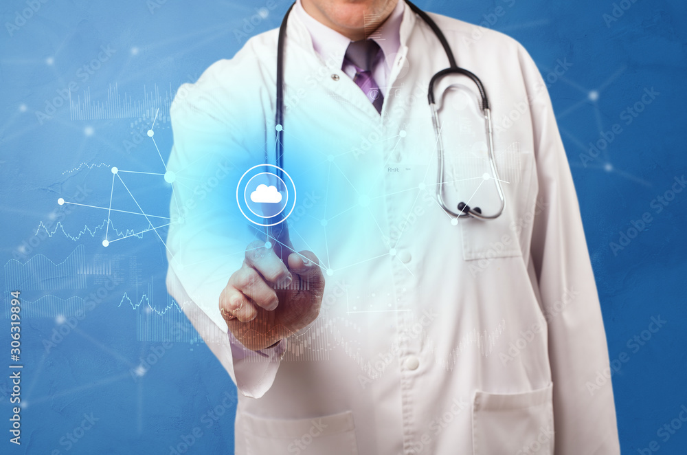 Doctor touching blue screen with virtual hospital concept Doctor touching blue screen with virtual hospital concept