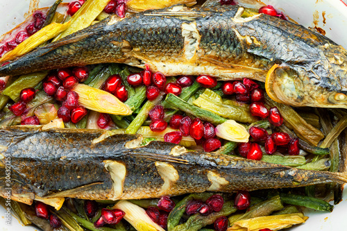 Baked fish with pomegranate photo