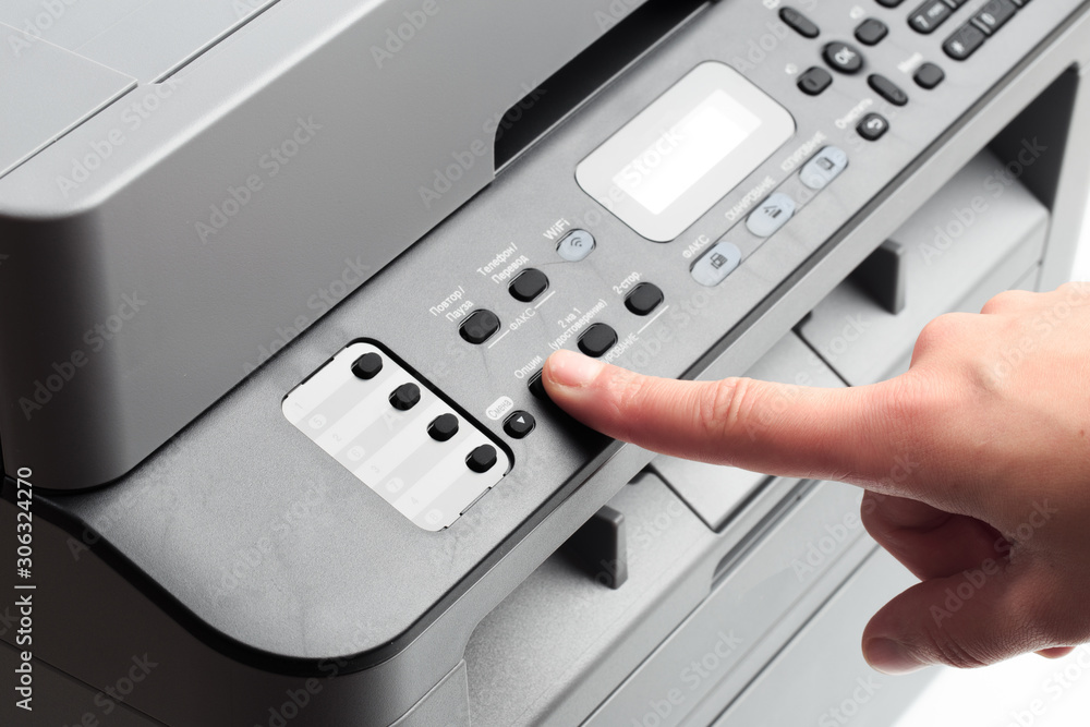 Hand press button on panel of printer. printer scanner laser office copy machine supplies start concept - Image Hand press button on panel of printer. printer scanner laser office copy machine supplies start concept - Image