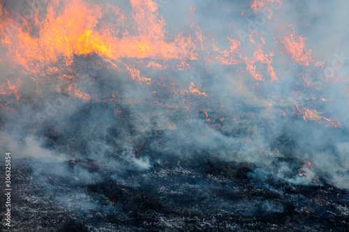 Big fire in the field.