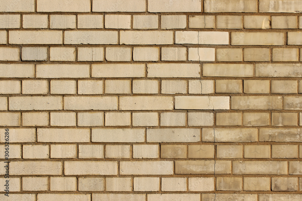 Partly renovated yellow brick work background wall texture Partly renovated yellow brick work background wall texture