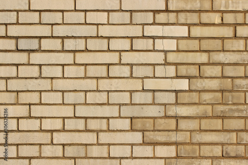 Partly renovated yellow brick work background wall texture