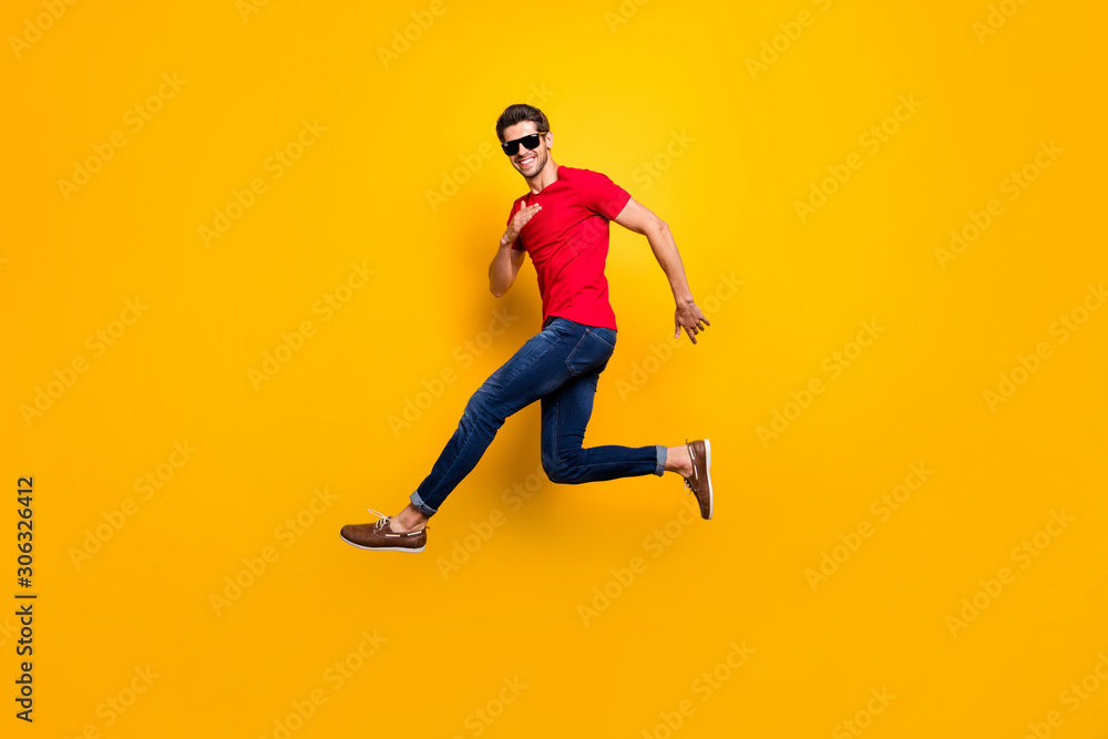Full body photo of cheerful content guy jump enjoy spring free time holidays wear good looking outfit sneakers isolated over bright color background
