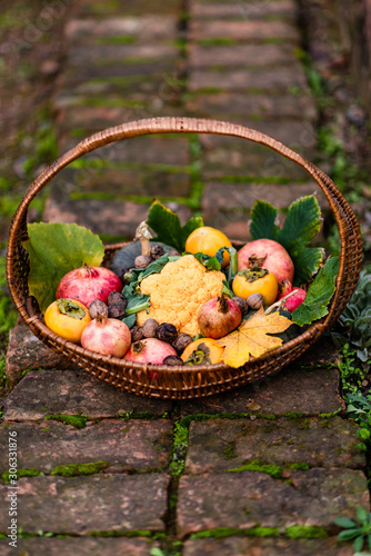 Basket with autumnal vegetable and fruit