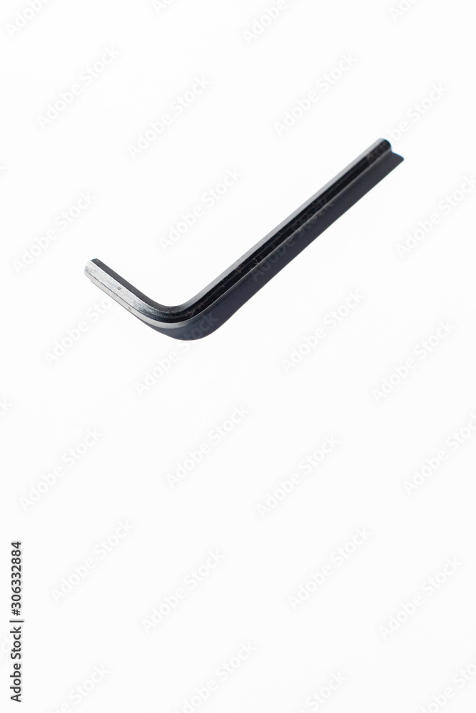 Hex key on white surface. Hex key on white surface.