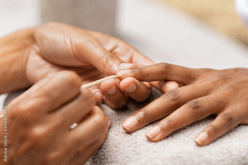 Woman getting manicure in spa - obrazy, fototapety, plakaty 