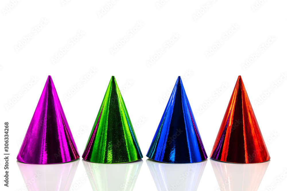 Four colorful party hats with reflections, isolated on white background, Birthday party and silvester Four colorful party hats with reflections, isolated on white background, Birthday party and silvester