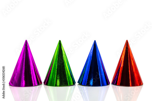 Four colorful party hats with reflections  isolated on white background  Birthday party and silvester