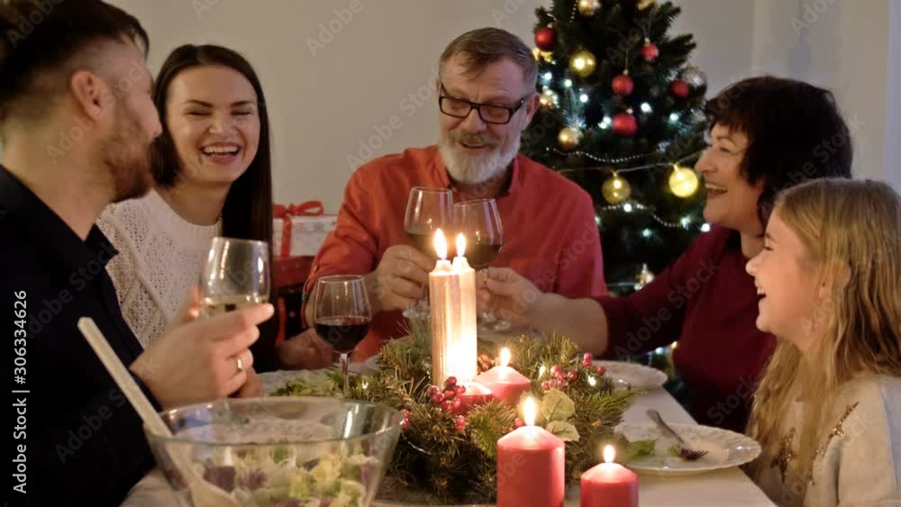 Merry Christmas. Happy family are having dinner at home. Celebration holiday and togetherness near tree. Merry Christmas. Happy family are having dinner at home. Celebration holiday and togetherness near tree.