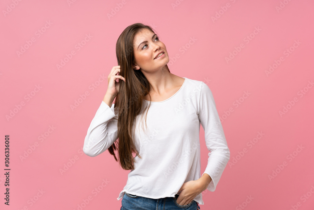 Young woman over isolated pink background thinking an idea Young woman over isolated pink background thinking an idea